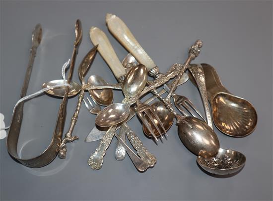 Fifteen pieces of sundry George III, Victorian and later cutlery, including a pair of George III sugar tongs.